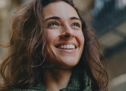 Happy woman after a chin implant