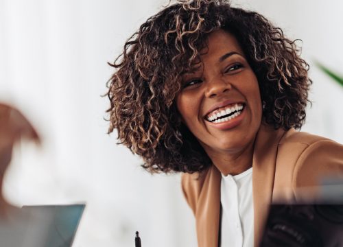 Happy woman at work after facial reconstruction