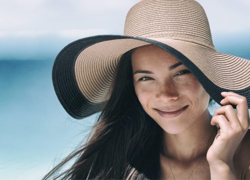 Woman at the beach with sun damage