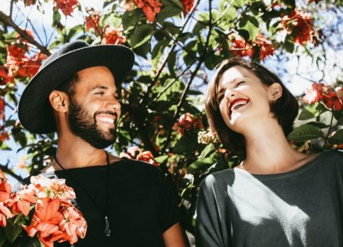 man and women smiling in nature