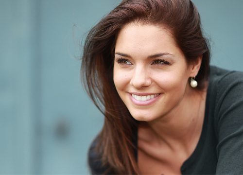 Smiling brunette after a Vivace RF microneedling treatment