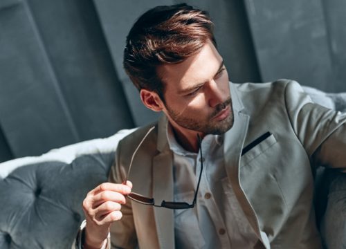 Man with a weak chin wearing a suite