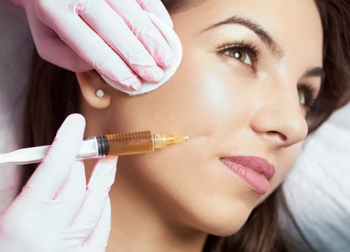 Woman receiving an injectable treatment